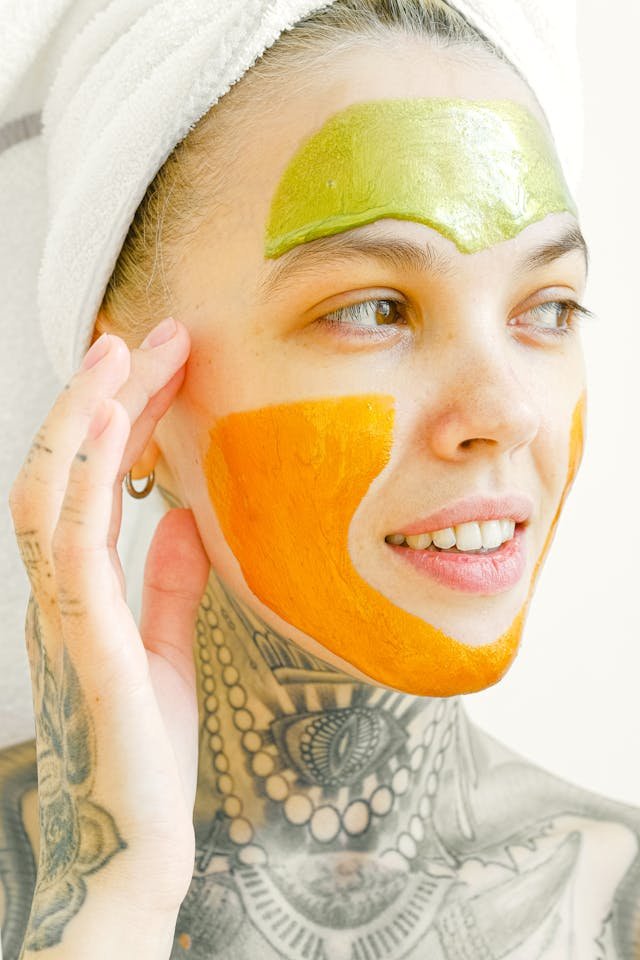 a woman with a white towel on her head and a face mask